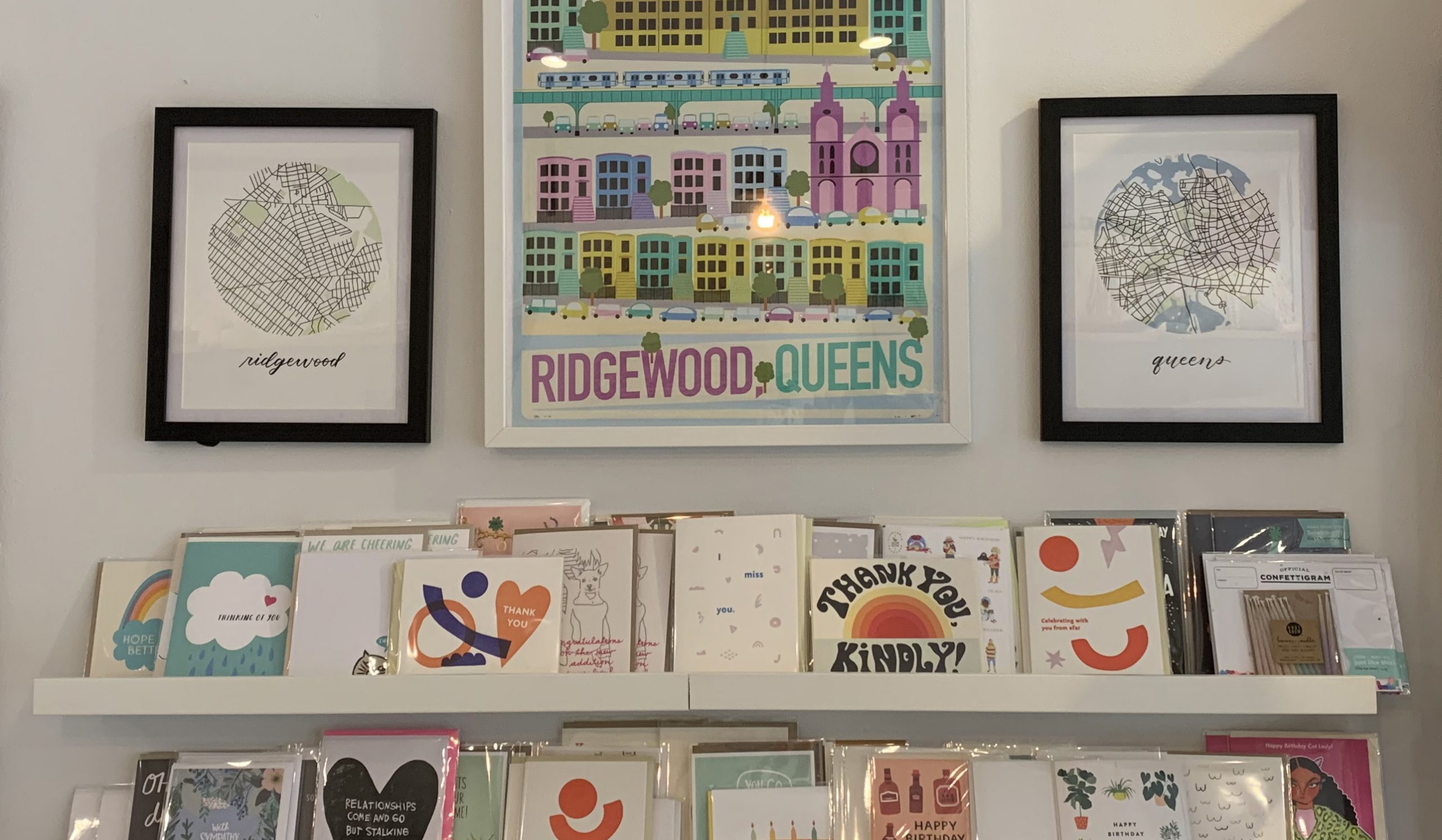 Ridgewood and Queens map prints hanging in Saint Seneca shop
